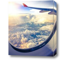 Картина Вид из иллюминатора самолета на облака